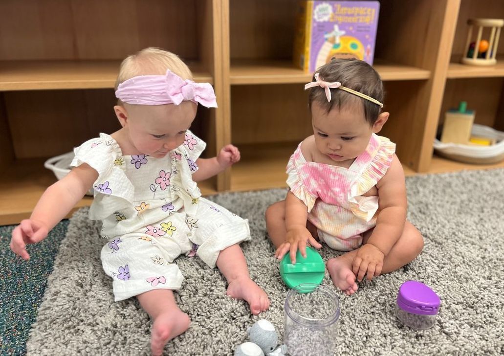 Montessori Infants working together  in the classroom.