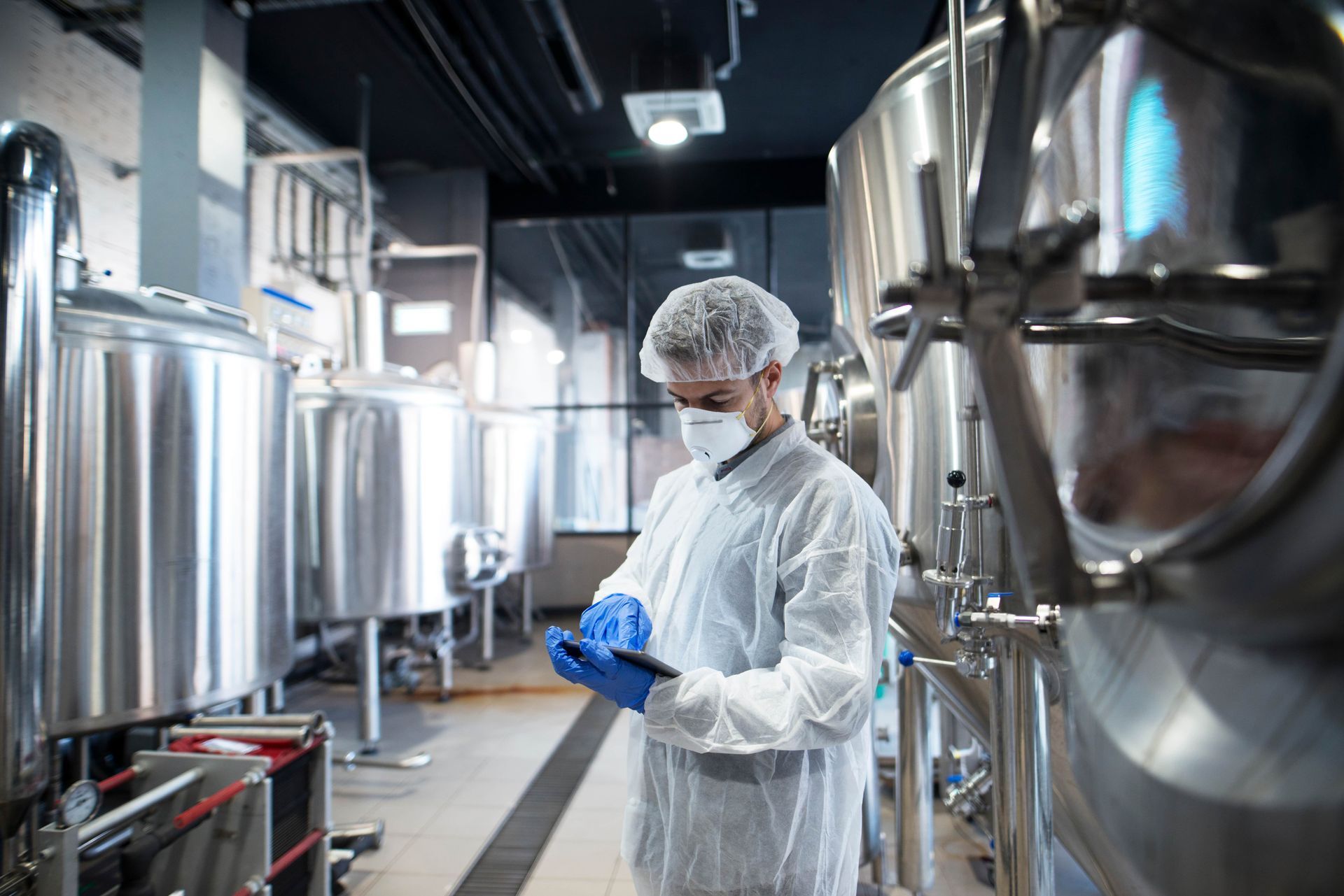 pharmaceutical factory worker in protective gear