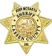 A gold-toned, seven-pointed Lassen County Sheriff badge engraved with