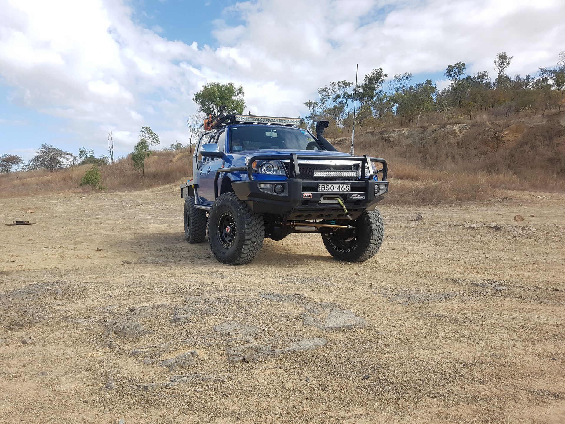 A Blue, Lifted 4x4 Pickup Truck Parked on A Dry — Ironhide Customs In Garbutt, QLD