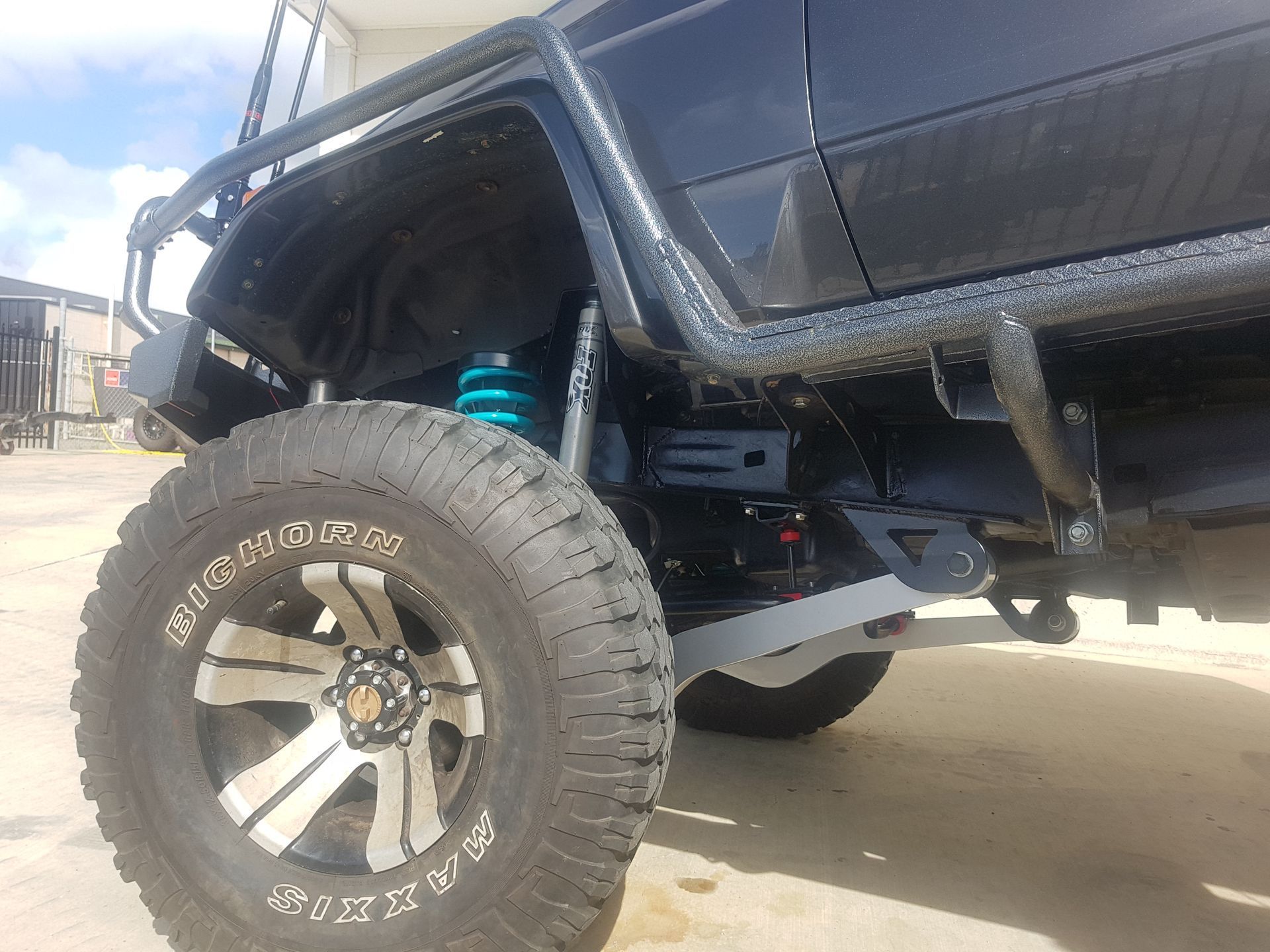 A Lifted Truck's Black Wheel &mdash; Ironhide Customs In Garbutt, QLD