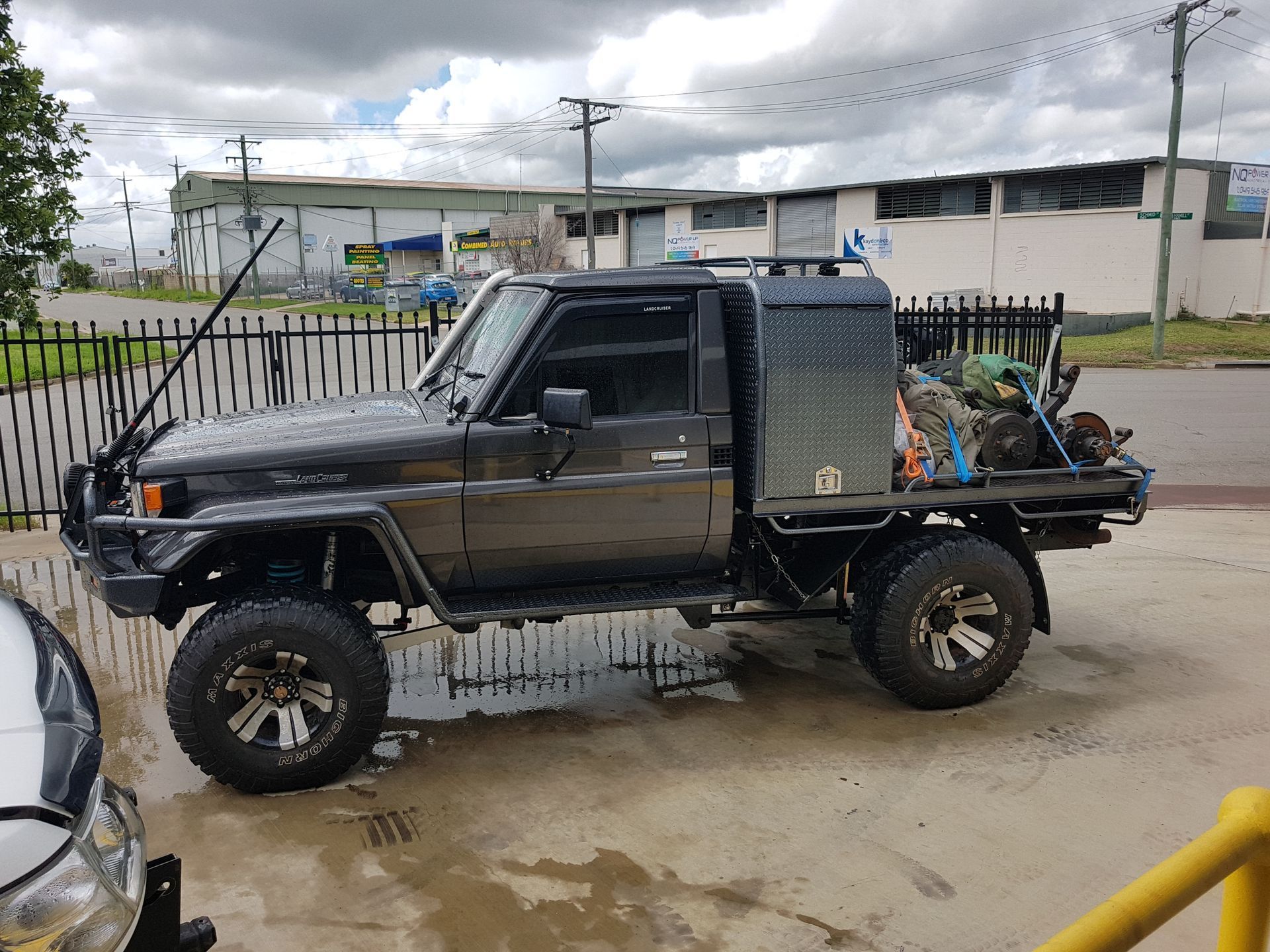 A Grey Toyota Land Cruiser Ute with A Black Diamond-Plate Canopy — Ironhide Customs In Garbutt, QLD