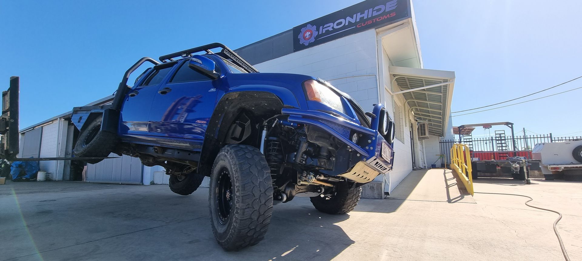 A Blue, Lifted 4x4 Pickup Truck — Ironhide Customs In Garbutt, QLD