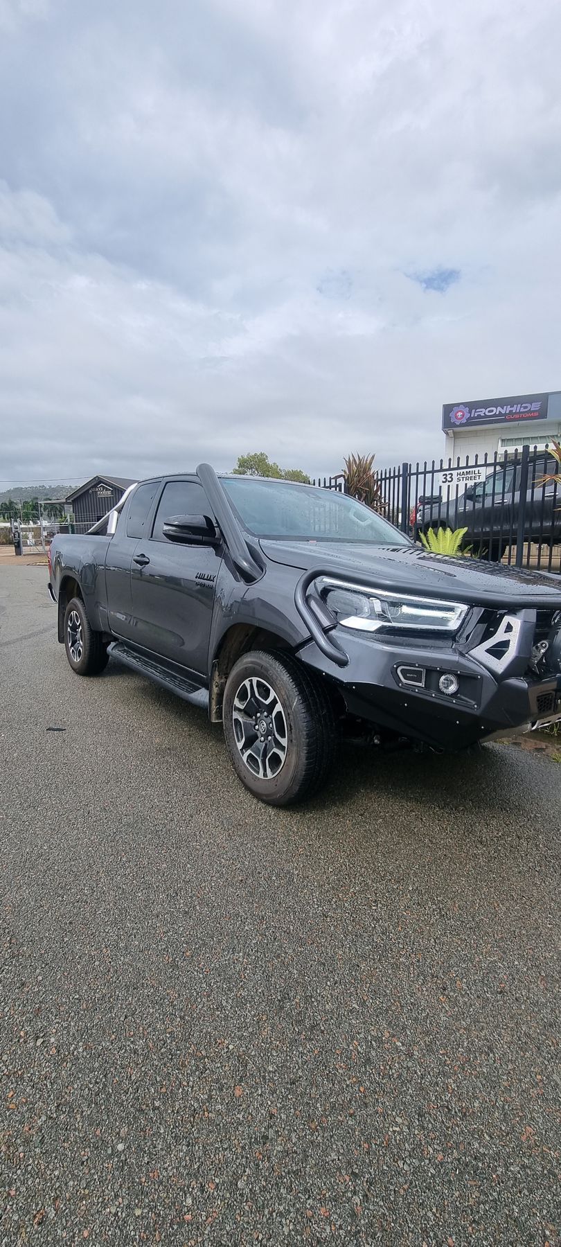 White Off-road SUV Parked Beside a Building — Ironhide Customs In Garbutt, QLD