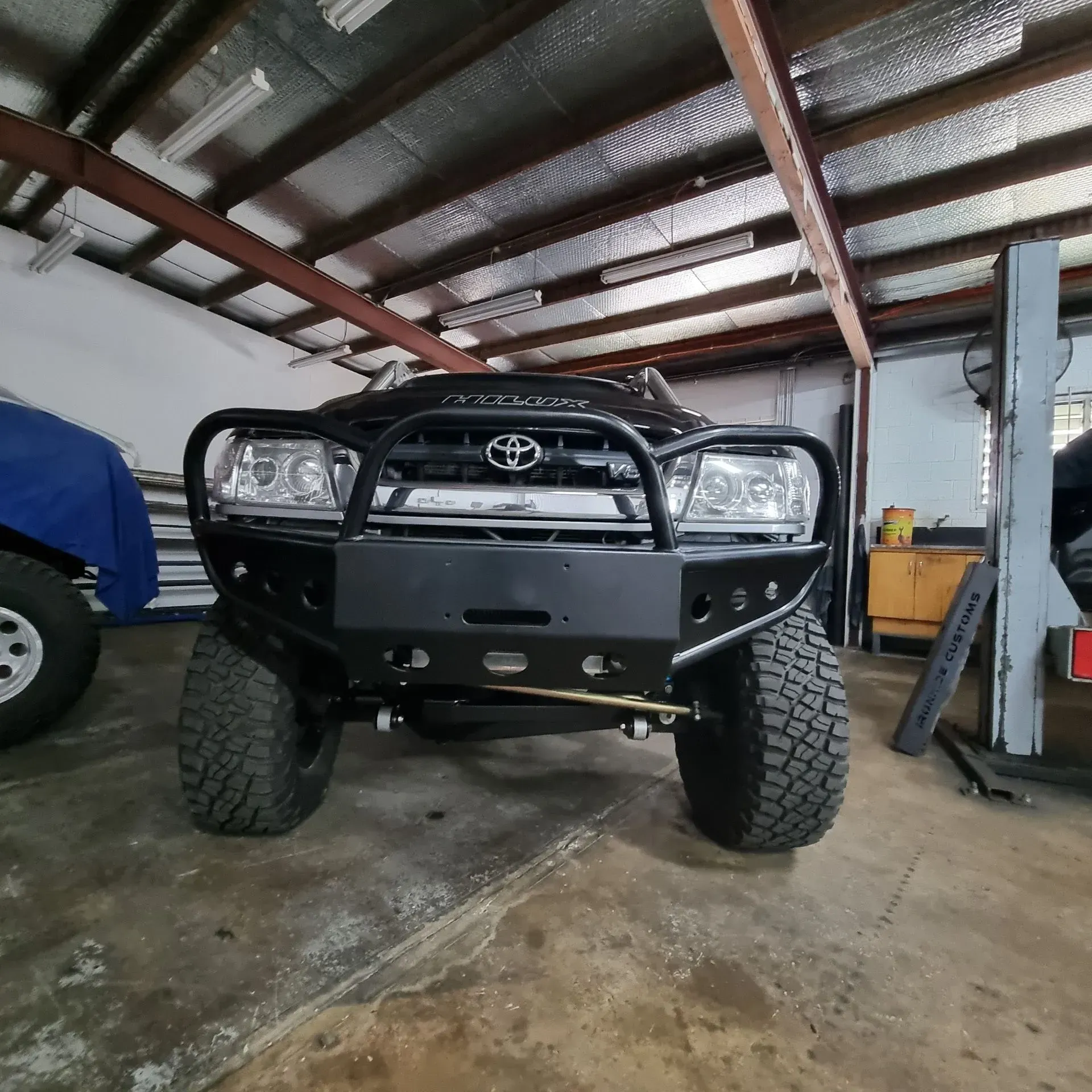 White Lifted Off-road Truck With Snorkel and Black Bull Bar — Ironhide Customs In Garbutt, QLD