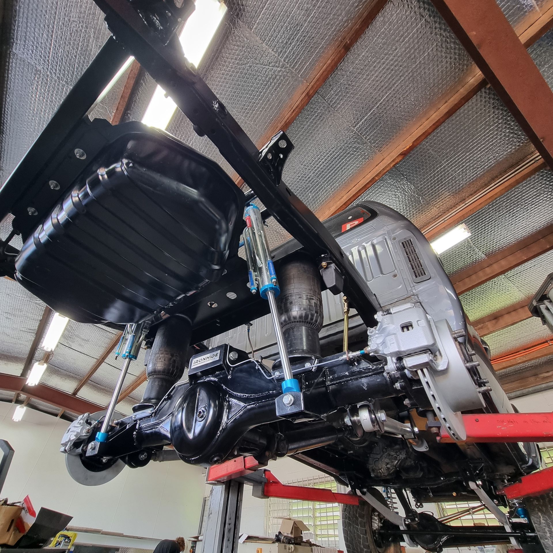 A Lifted Vehicle’s Undercarriage in A Garage — Ironhide Customs In Garbutt, QLD