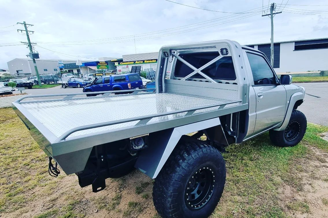 A Close-Up, High-Angle Shot of A White Suv with Black Off-Road Wheels — Ironhide Customs In Garbutt, QLD