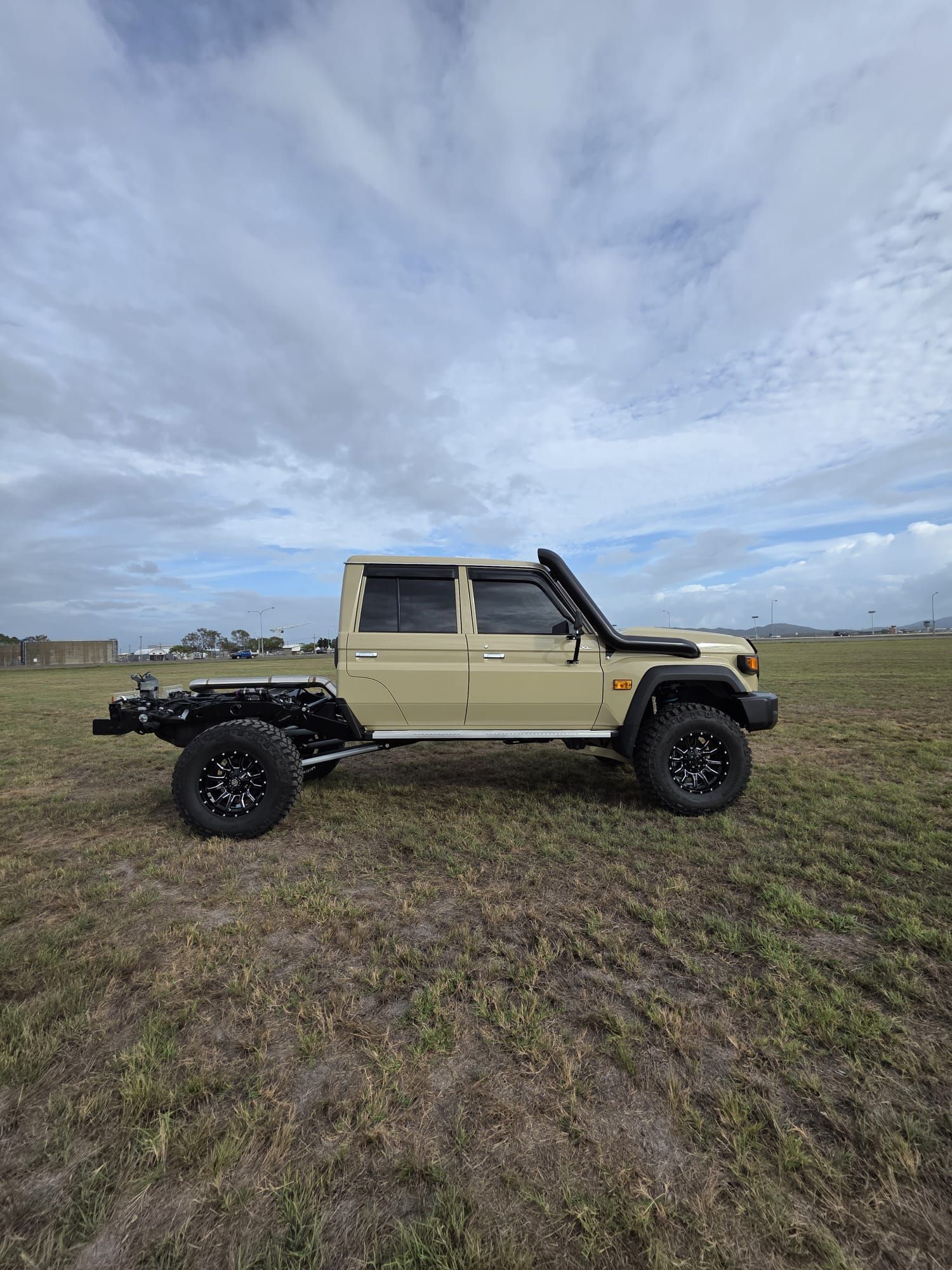A White Toyota Pickup Truck Modified for Off-Roading — Ironhide Customs In Garbutt, QLD