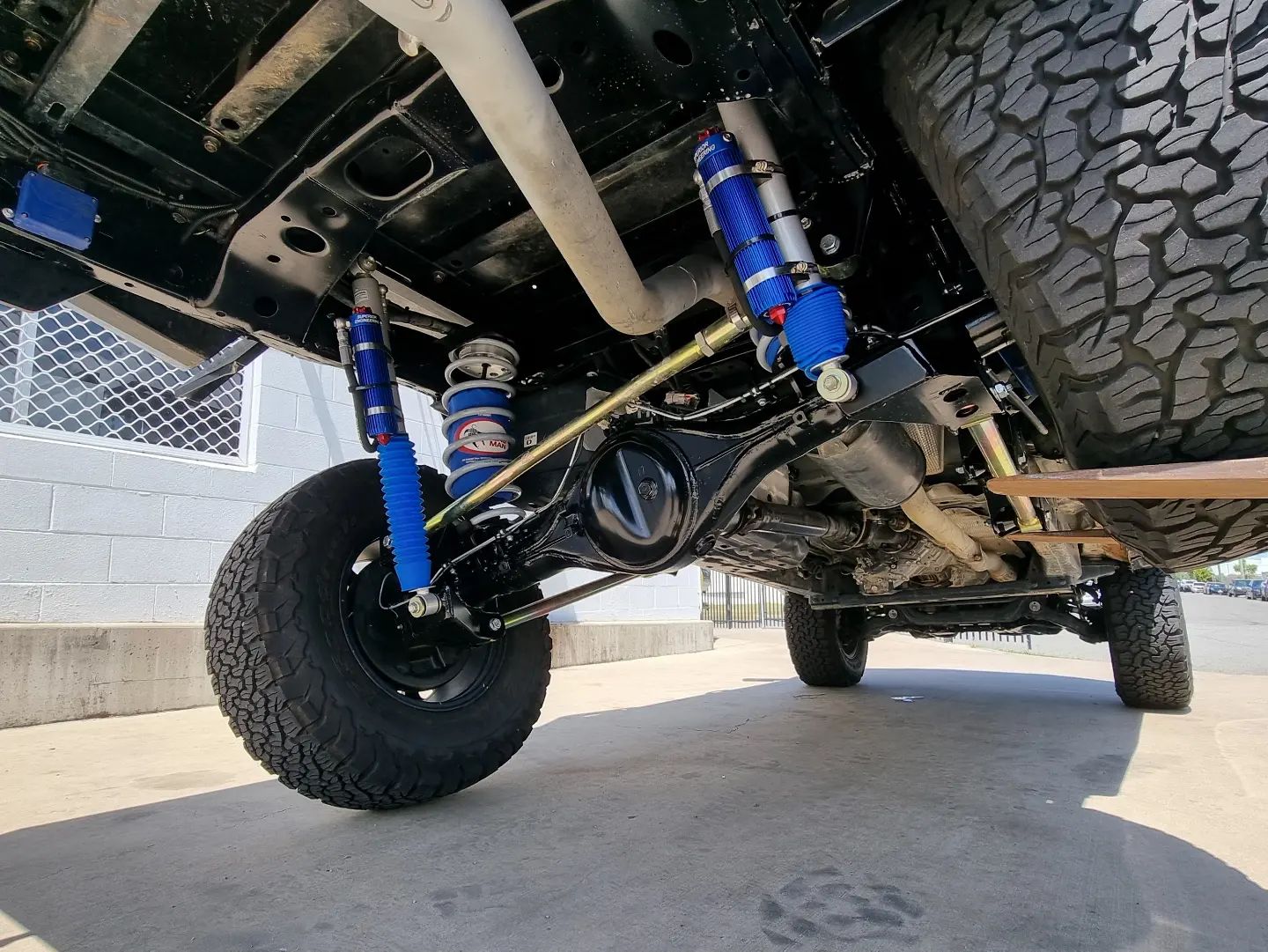 Front Suspension of A Truck Featuring Blue Springs &mdash; Ironhide Customs In Garbutt, QLD