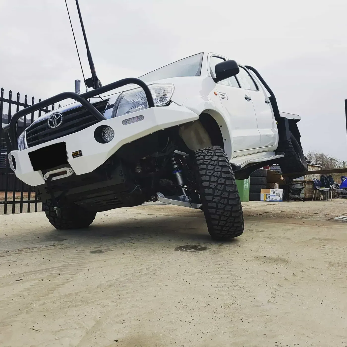 A White Toyota Pickup Truck Modified for Off-Roading — Ironhide Customs In Garbutt, QLD