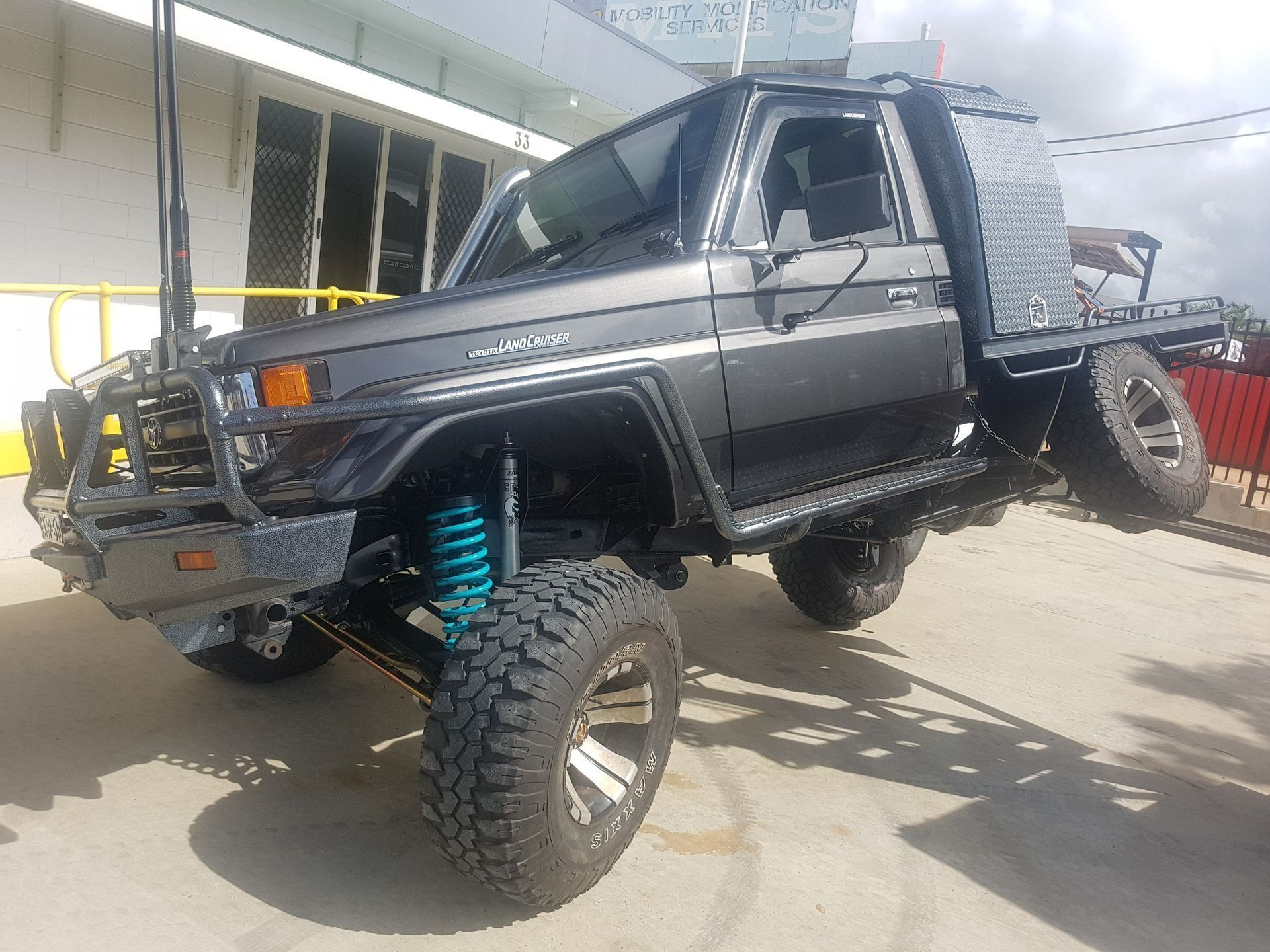 A Lifted Truck's Black Wheel &mdash; Ironhide Customs In Garbutt, QLD