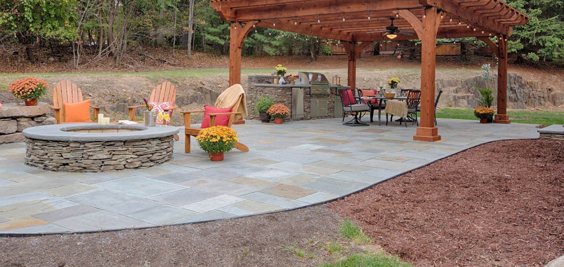 There is a fire pit in the middle of the patio.