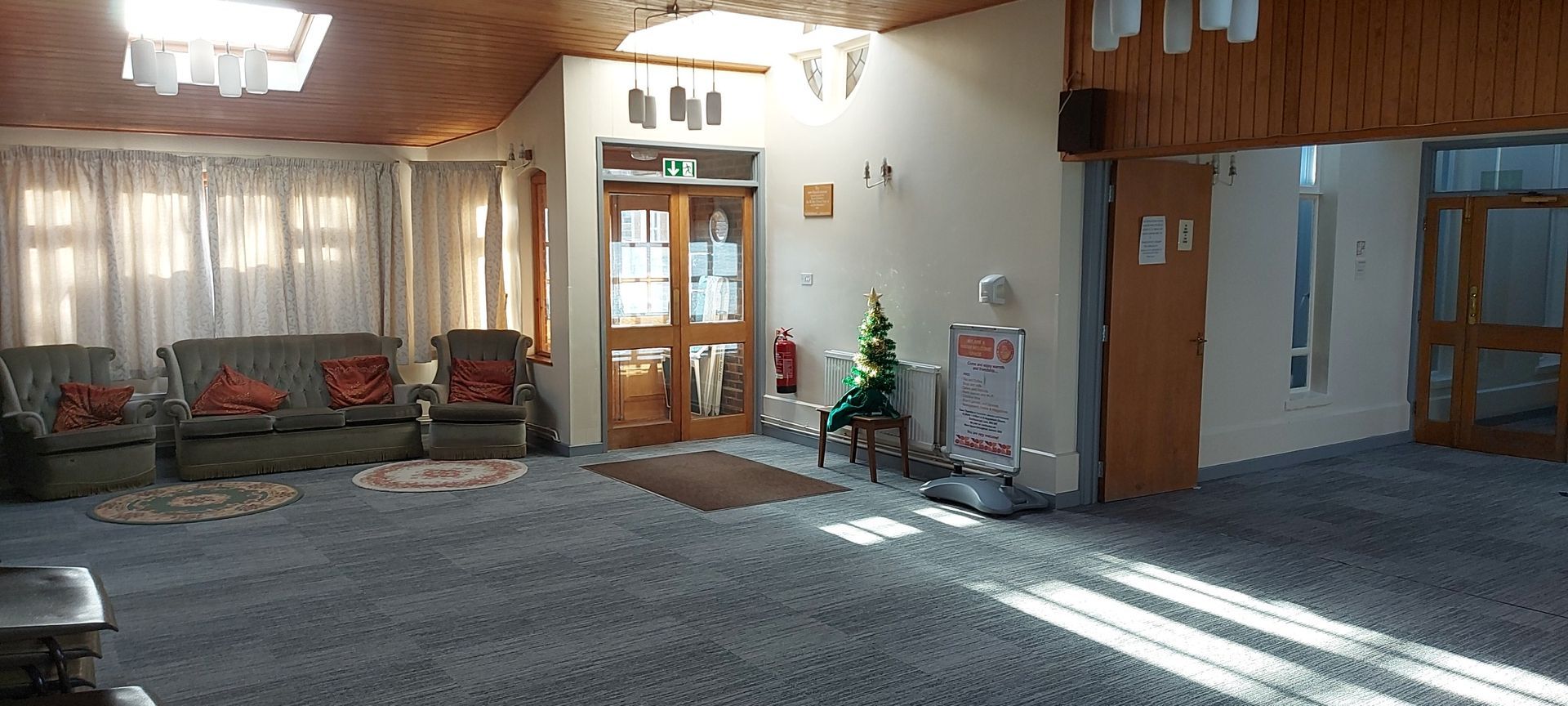 St Augustine Church Bromley Common Garden Room Hire - Spacious living room with sofas.