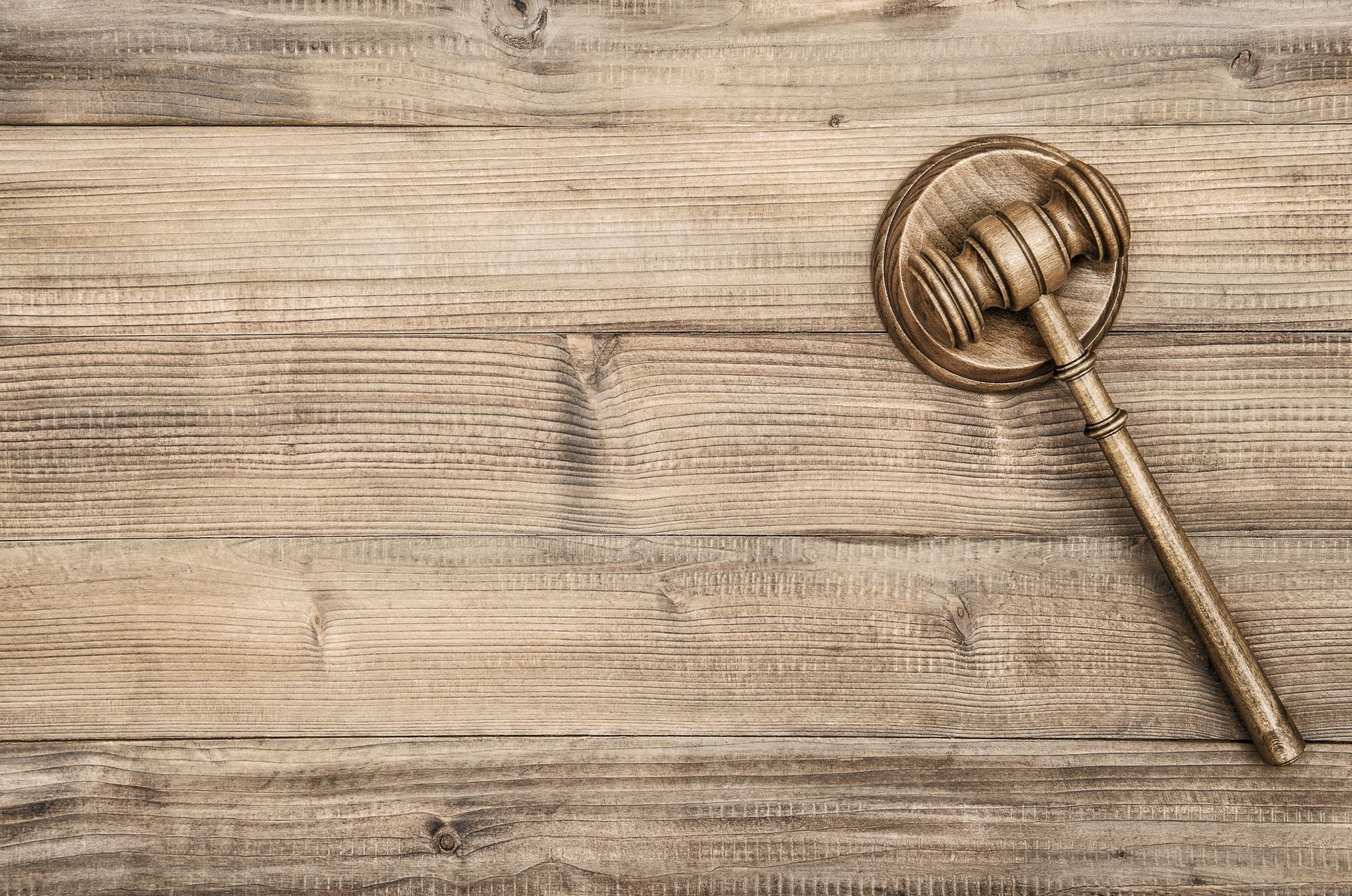 Gavel on a wooden surface. Gavel on a wooden surface.