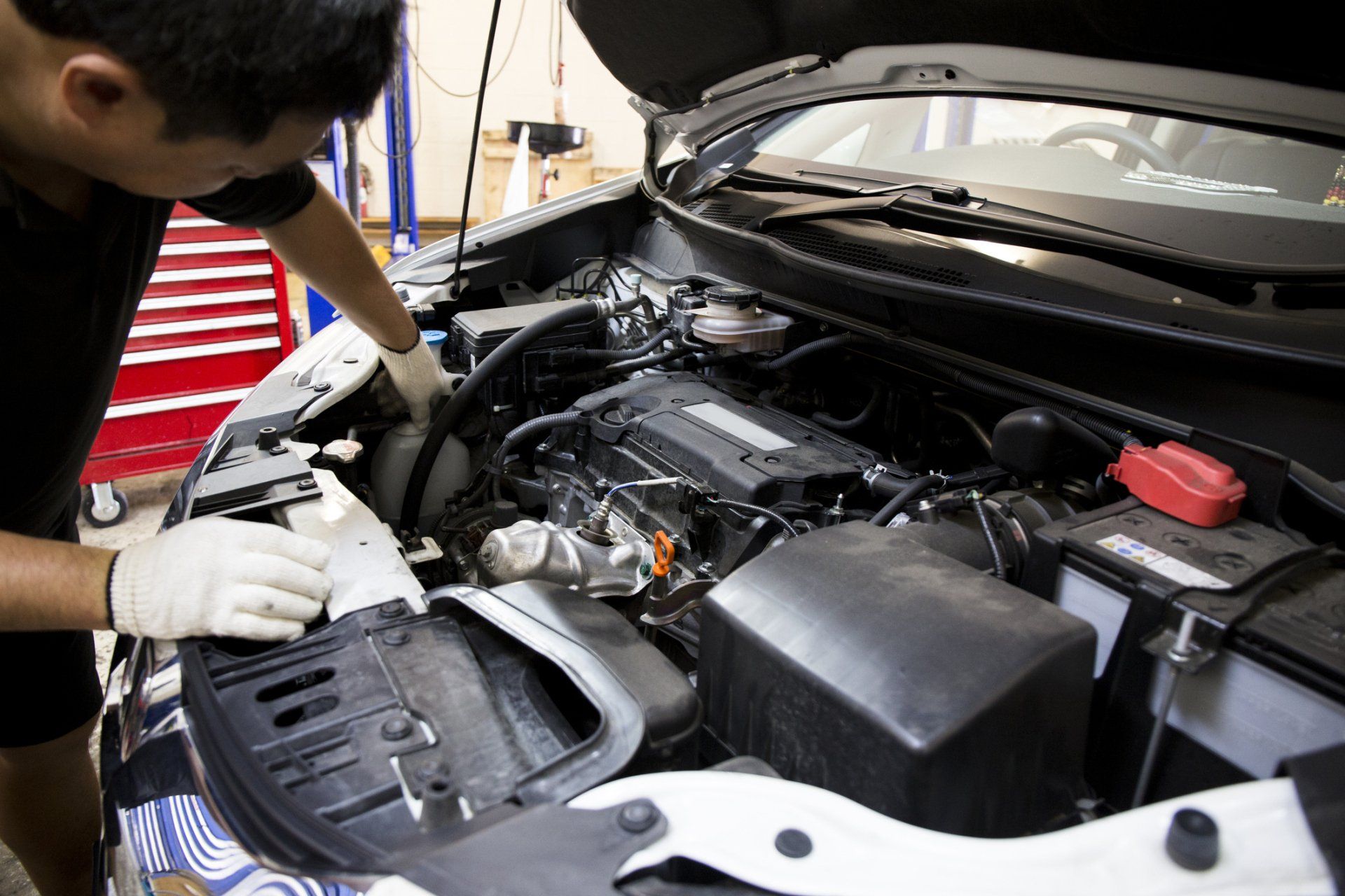 Mechanic Working On A Car In Garage — Lawson, NSW — Mark Harrison Automotive Services Mechanic Working On A Car In Garage — Lawson, NSW — Mark Harrison Automotive Services