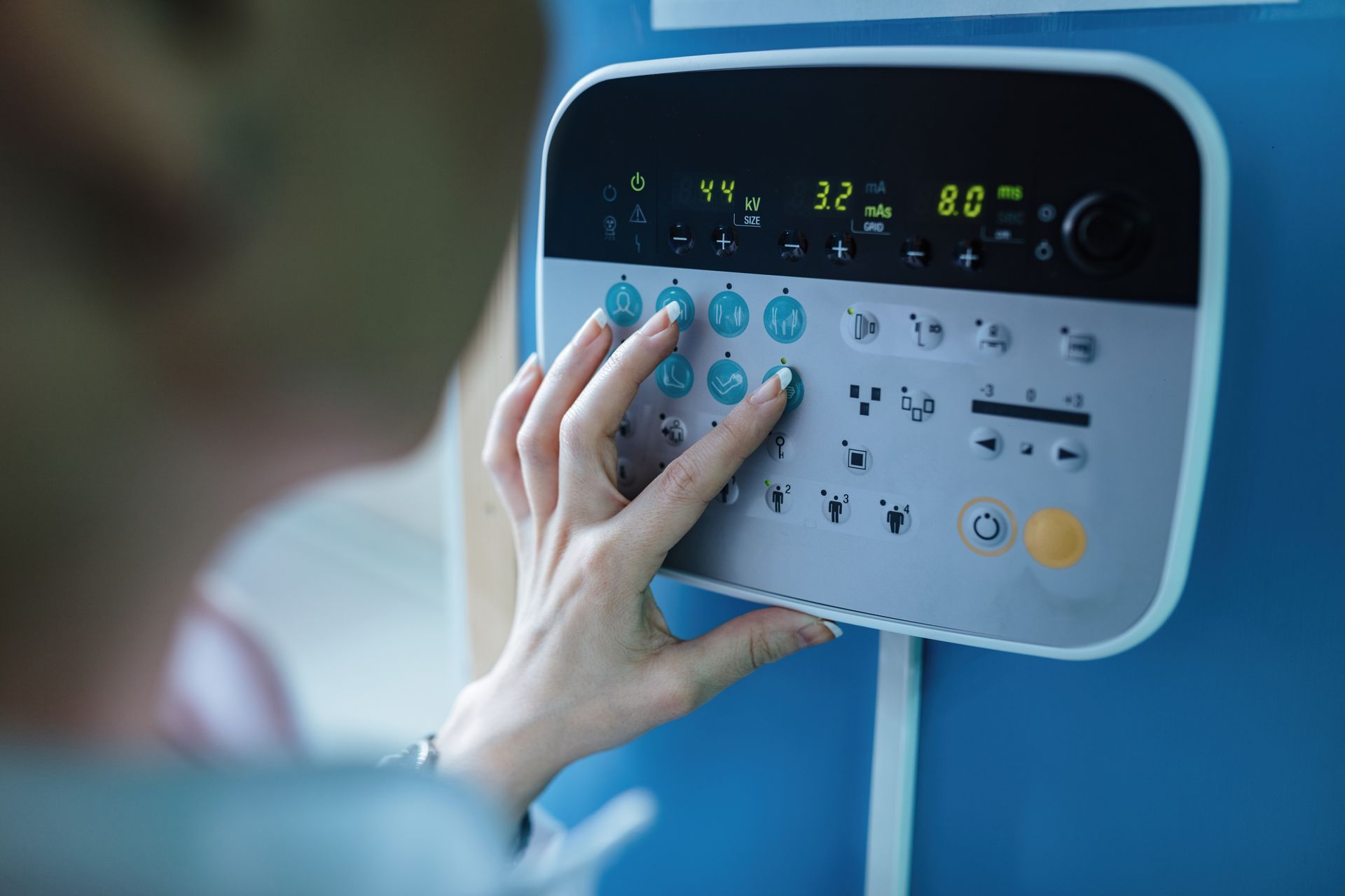 doctor checking heart monitor medical device