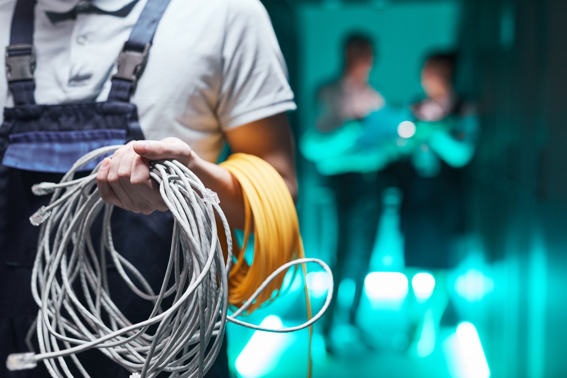 close up of worker carrying custom cables