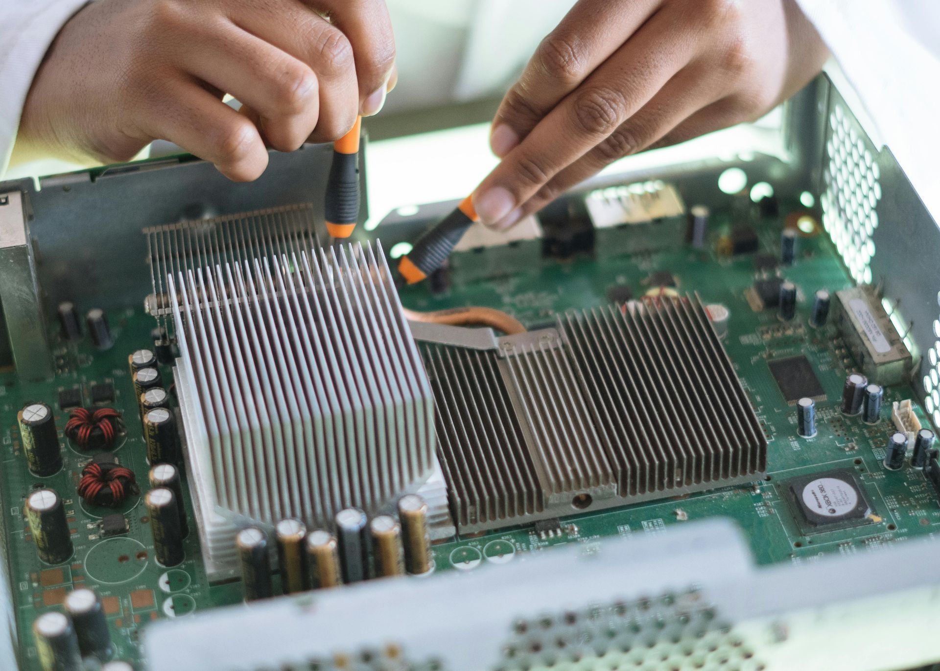 Technician working on circuit board during box assembly process