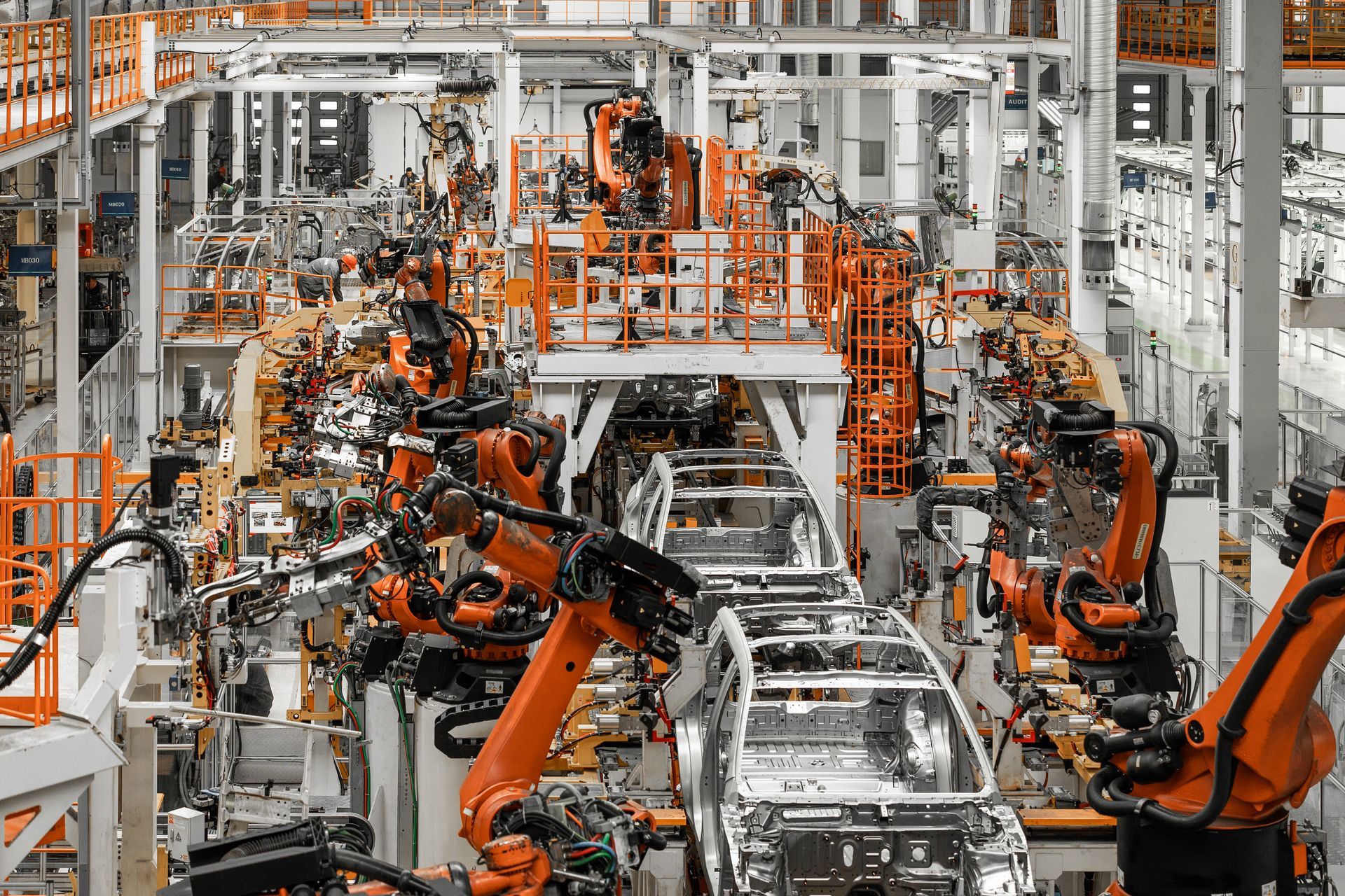 A factory filled with lots of robots making cars.