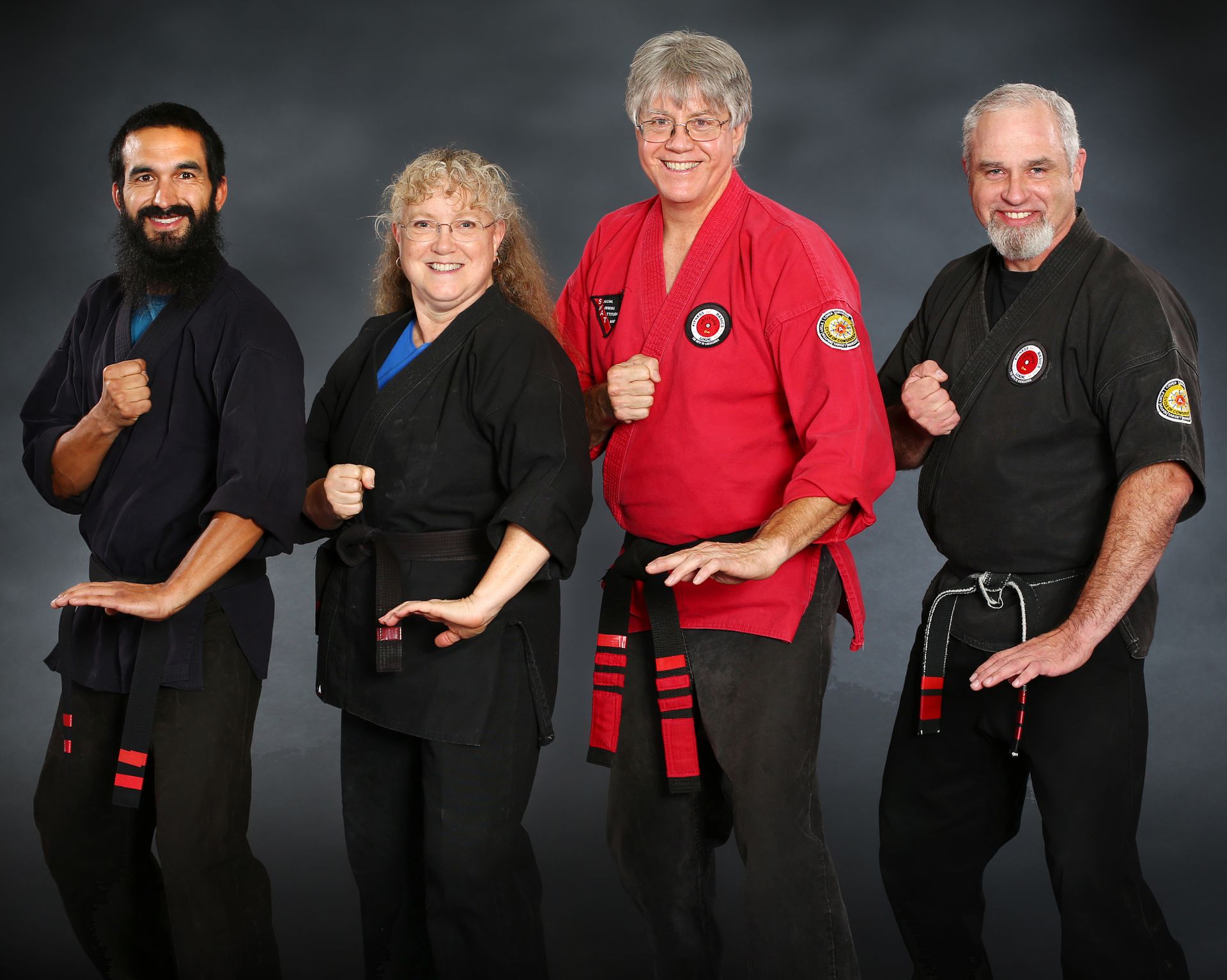 A group of people wearing martial arts uniforms are posing for a picture.