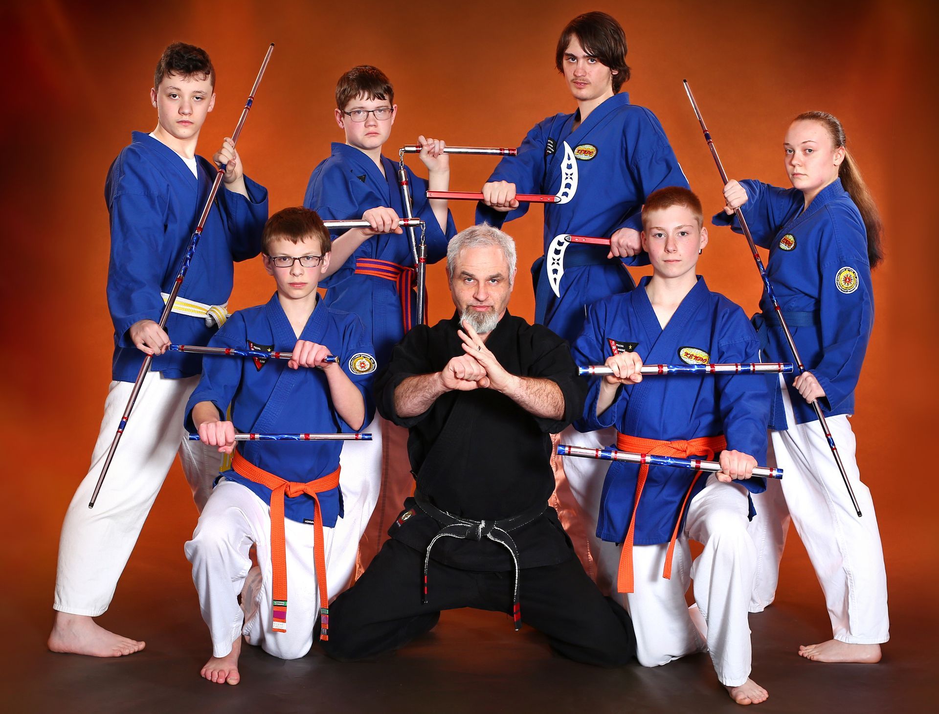 A group of martial arts students posing for a picture