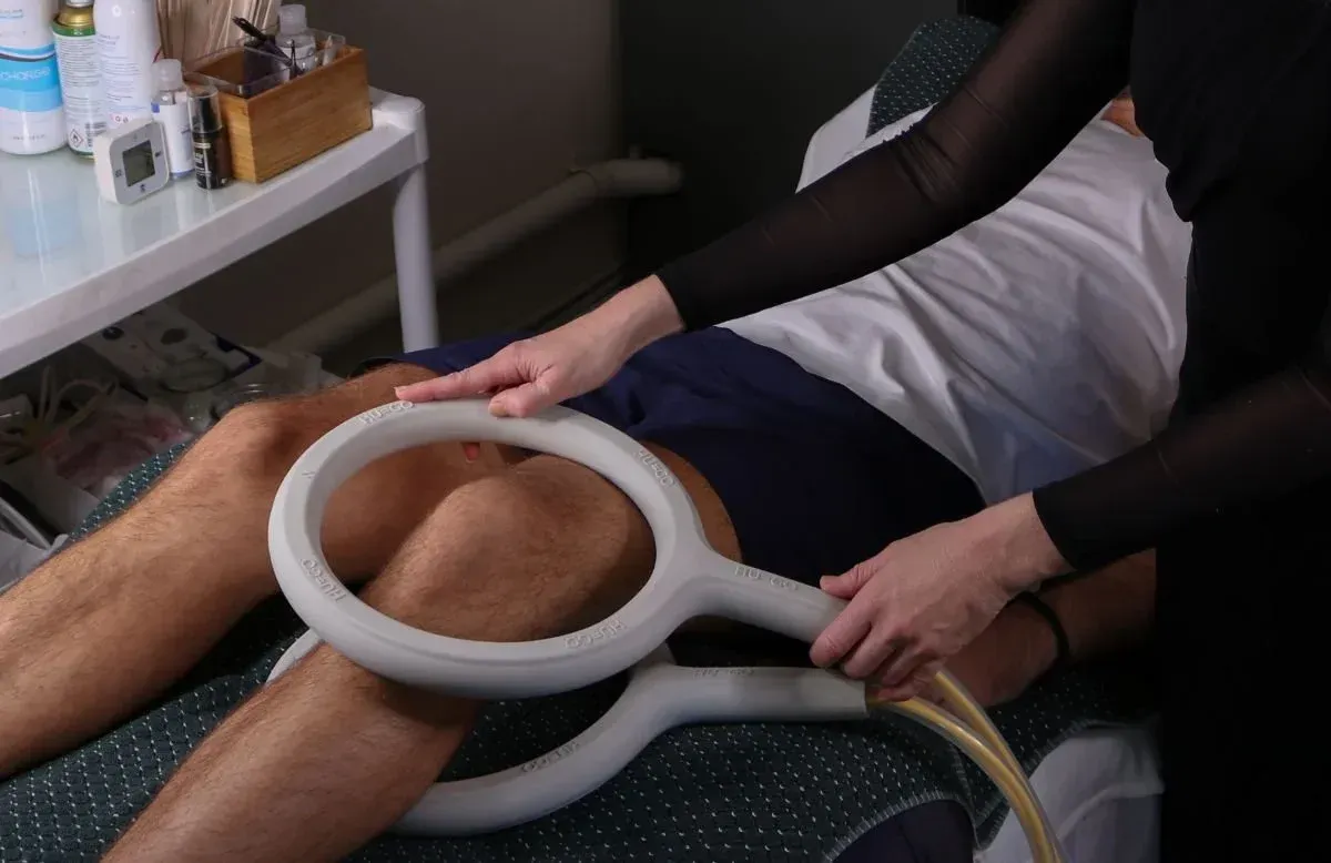 Hugo PEMF mat session in a calm, warmly lit treatment room