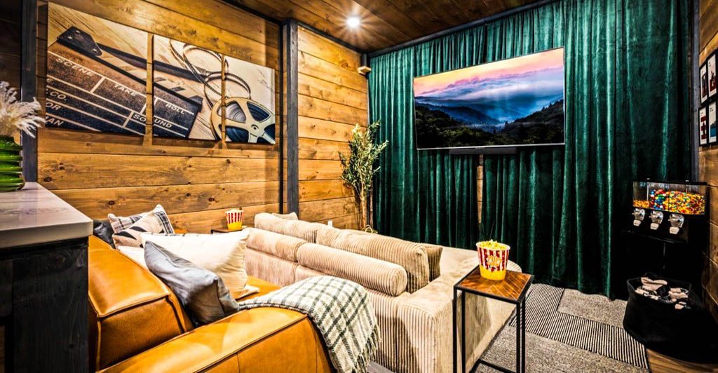 A living room with a couch , chair , table and television for photo staging.