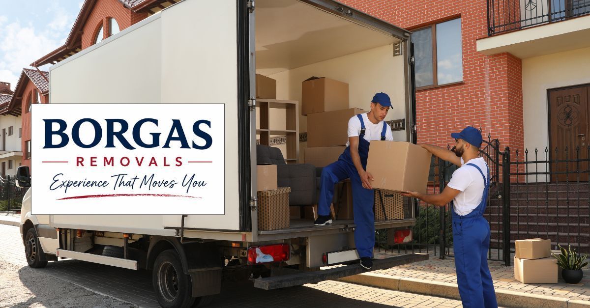 Borgas Removals team loading household furniture into a removal truck outside a home in Adelaide.