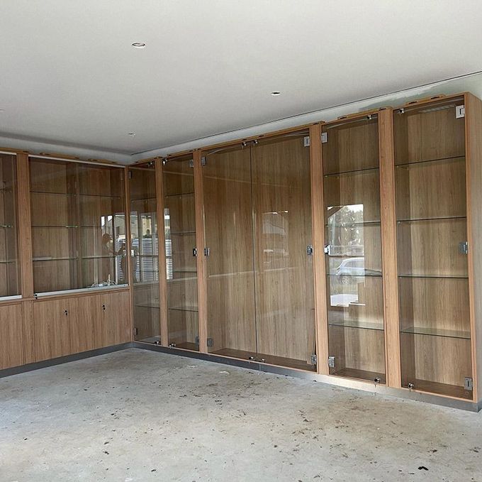 Wooden Cabinets With Glass Doors — Moore Park Beach Glass & Security in Moore Park Beach, QLD