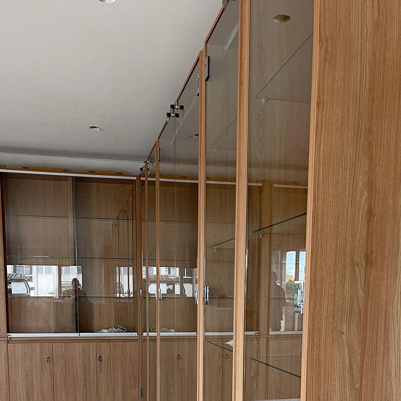 Room With Wooden Cabinets and Glass Doors — Moore Park Beach Glass & Security in Moore Park Beach, QLD