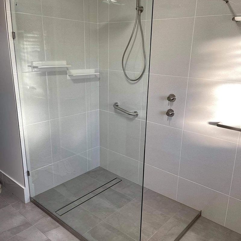 Bathroom With a Walk in Shower With a Glass Door — Moore Park Beach Glass & Security in Gin Gin, QLD