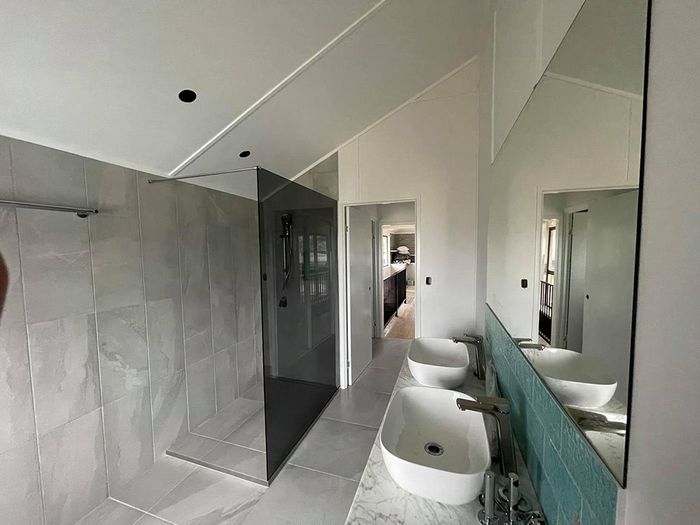 Modern Bathroom With a Walk-in Shower, Two Sinks — Moore Park Beach Glass & Security in Moore Park Beach, QLD