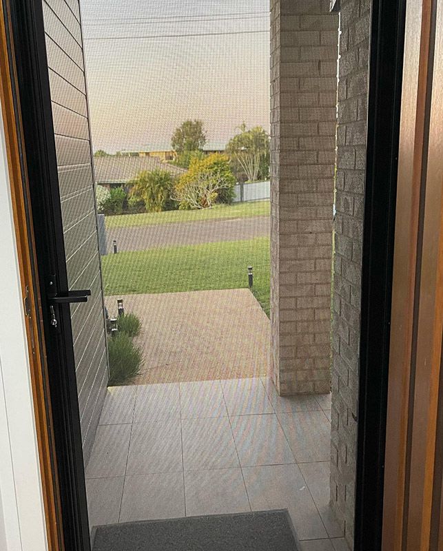 Door With a Screen on it Leading to a Porch — Moore Park Beach Glass & Security in Moore Park Beach, QLD