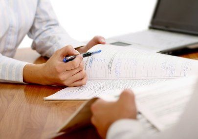 An attorney and a client discussing a breach of contract.