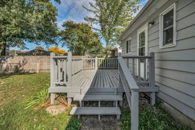 Wood deck in the backyard of a home