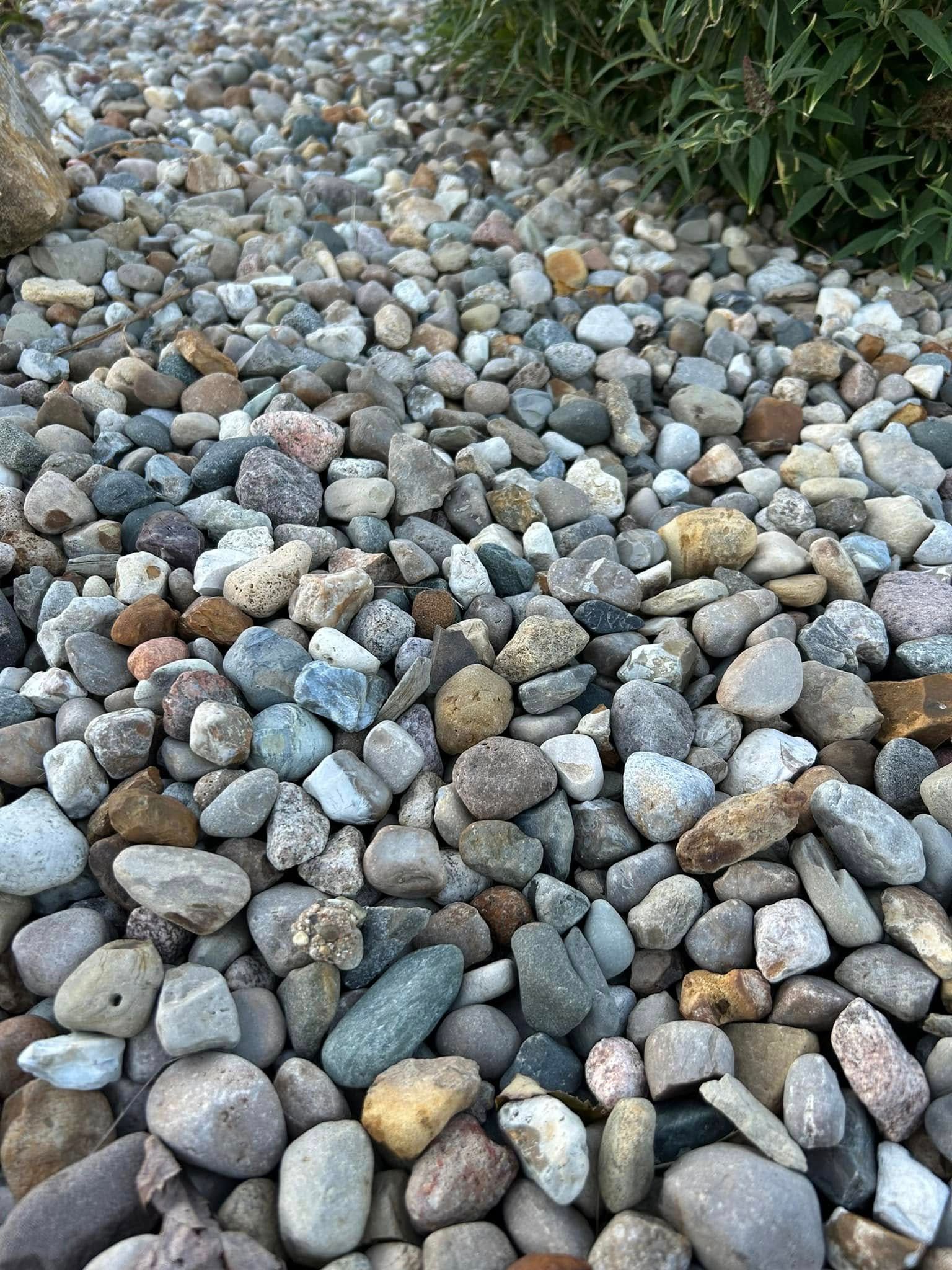 Close-up of a gravel path with varied colored stones.