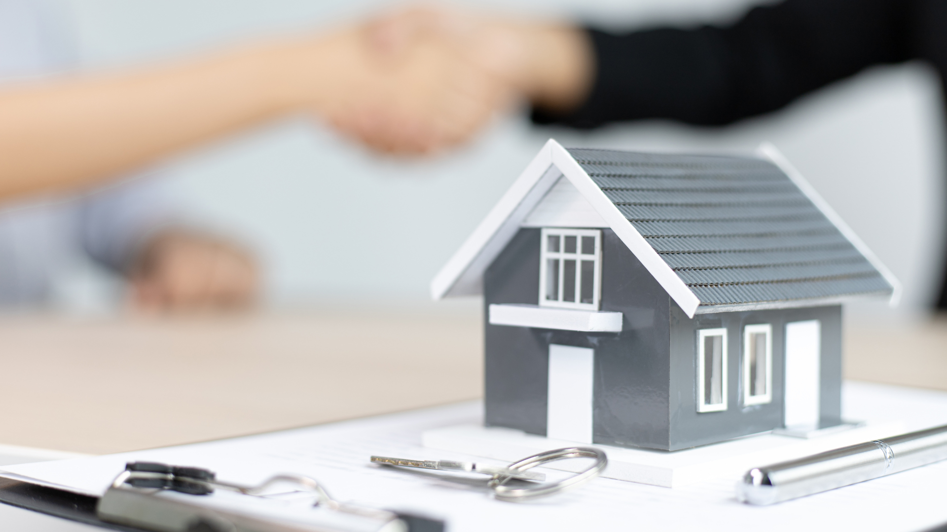 Real Estate Attorney shaking hands with client