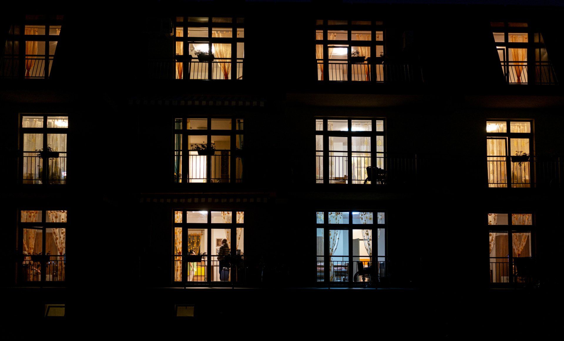 Illuminated Windows Of Night House With People Inside - Hendersonville, NC - Tucker Heating & Air Illuminated Windows Of Night House With People Inside - Hendersonville, NC - Tucker Heating & Air