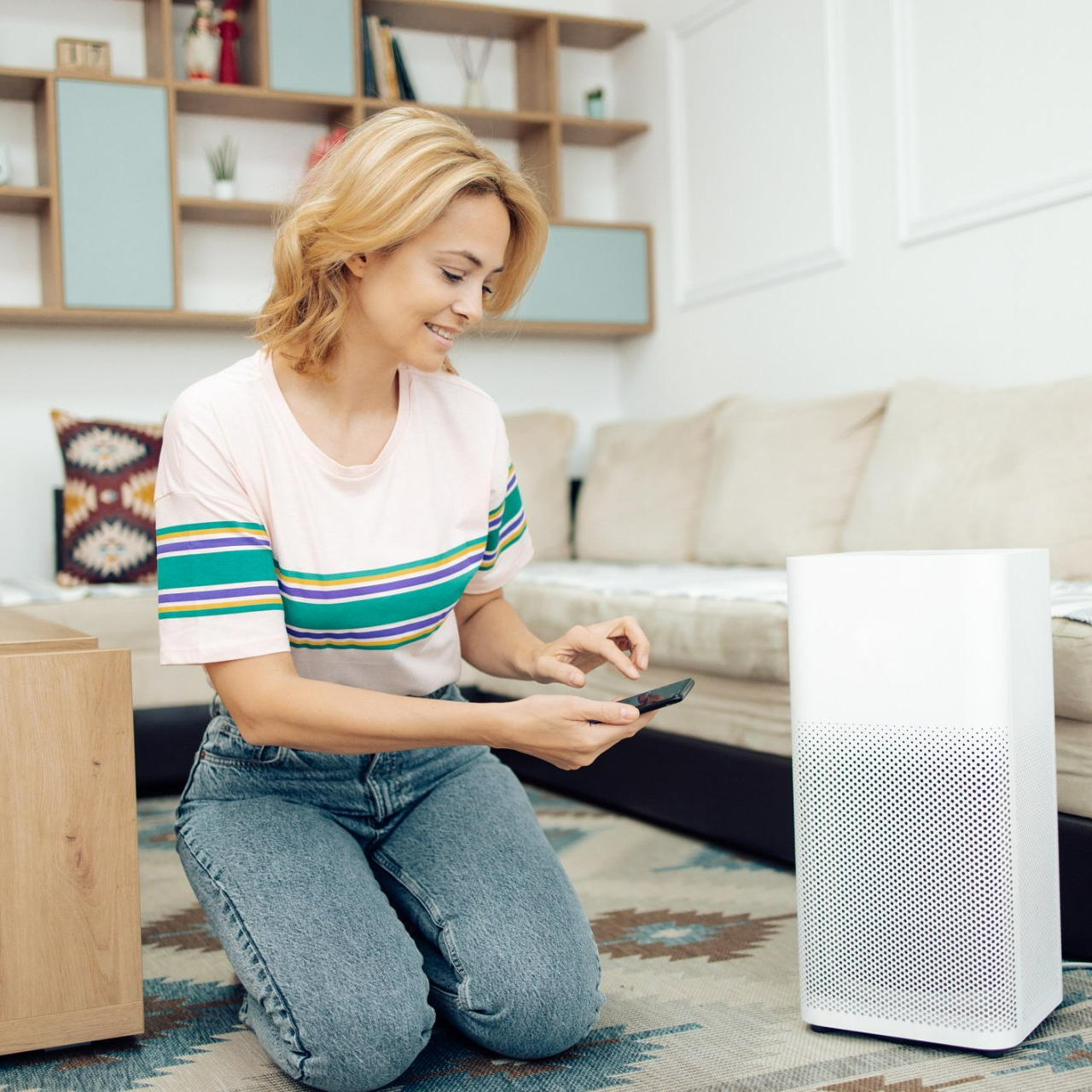 Woman Adjusting A Home Air Cleaner Using A Smart System - Hendersonville, NC - Tucker Heating & Air Woman Adjusting A Home Air Cleaner Using A Smart System - Hendersonville, NC - Tucker Heating & Air