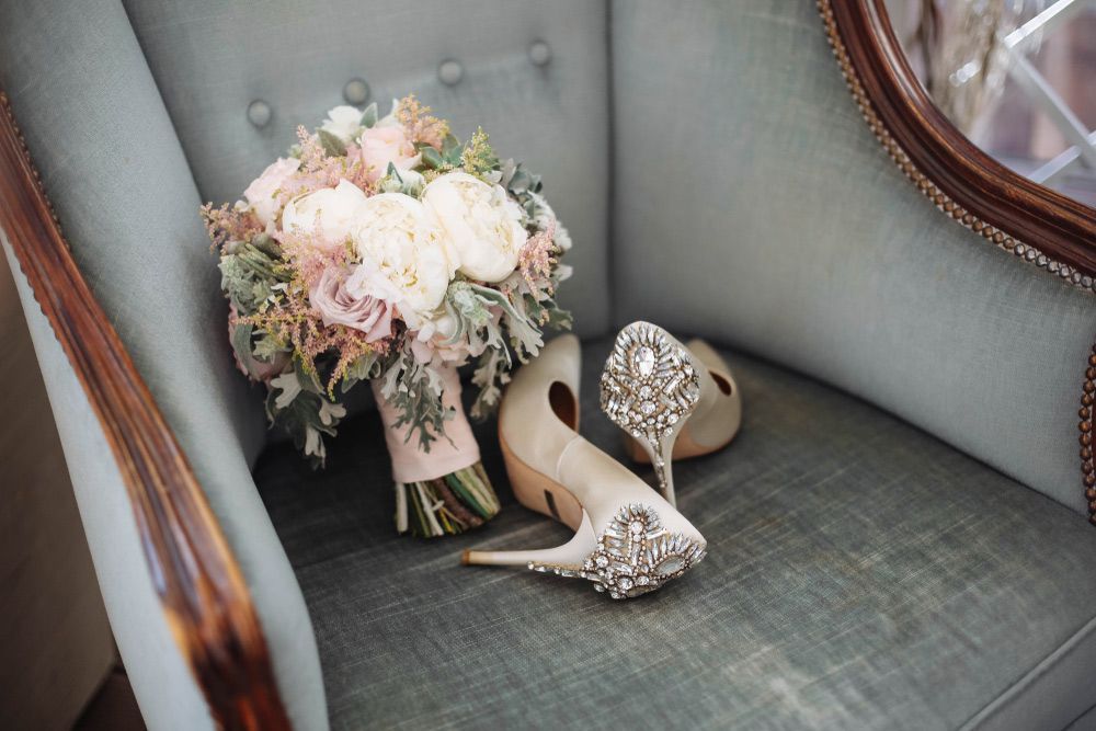 A Bouquet of Flowers and A Pair of Shoes Are Sitting on A Chair — Pick-A-Bunch Florists & Gifts In Hay Point, QLD