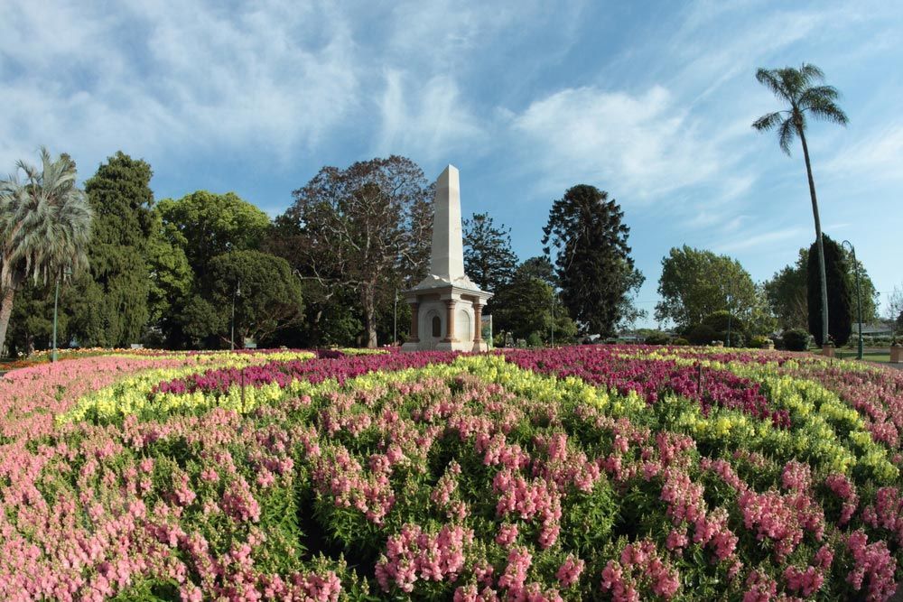 A Statue in The Middle of A Field of Flowers — Pick-A-Bunch Florists & Gifts In Alligator Creek, QLD