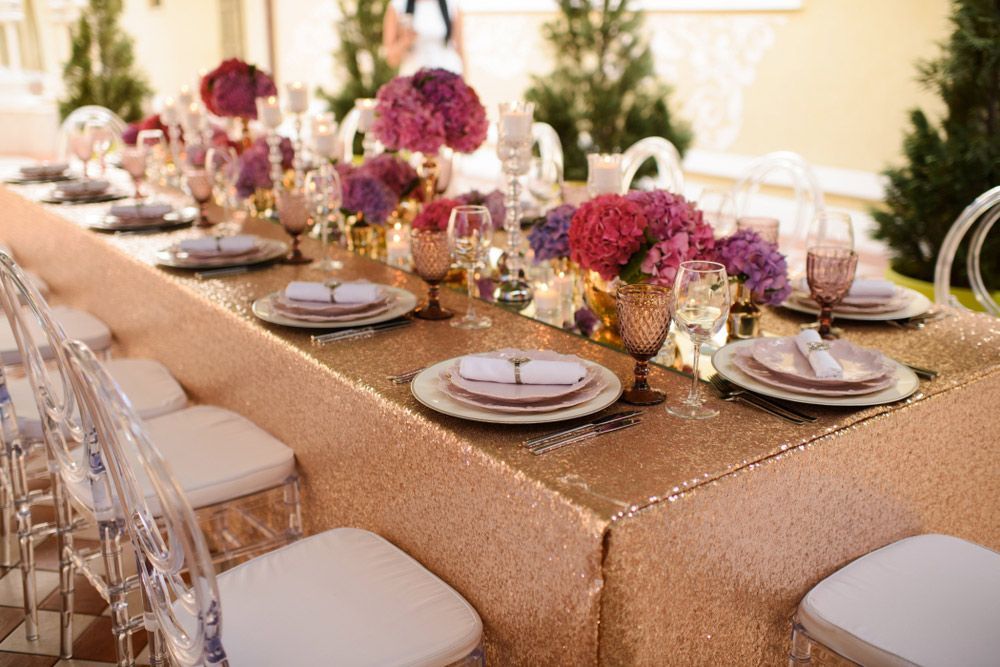 A Long Table with Plates, Glasses, and Flowers on It — Pick-A-Bunch Florists & Gifts In Sarina, QLD