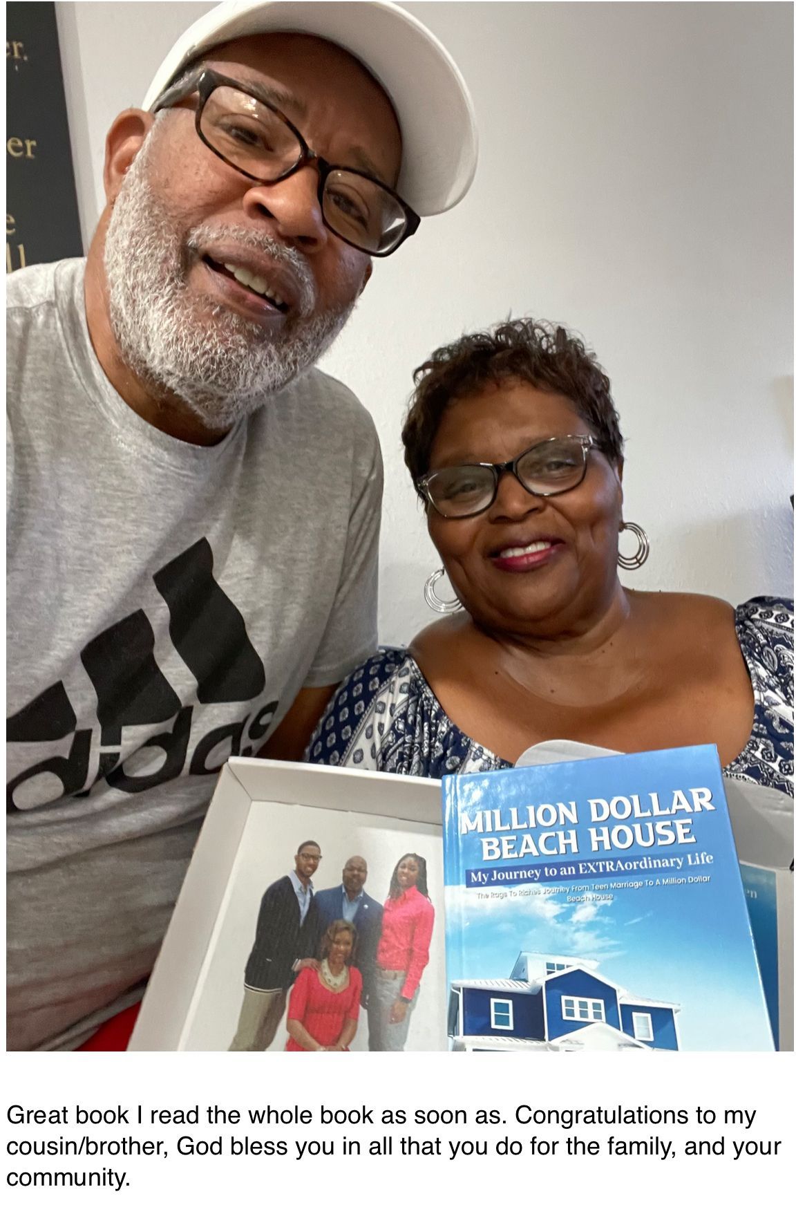 A couple holding a book titled 