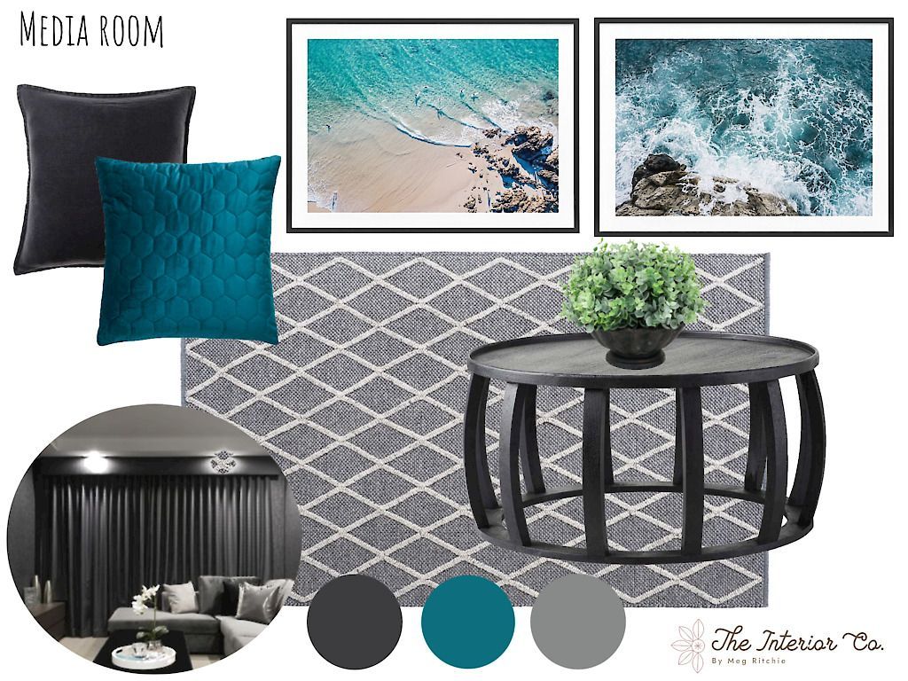 A living room with a couch , table , pillows , and a rug.