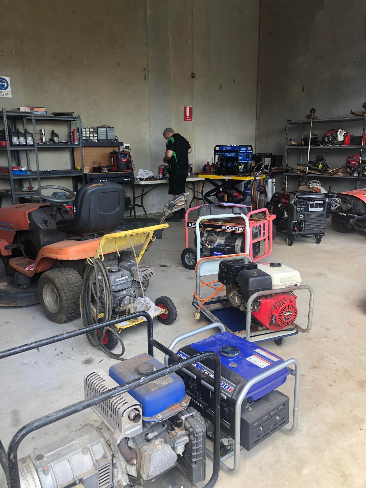 Workshop With a Person Working on Equipment — Cairns Small Engine Repairs in Bentley Park, QLD