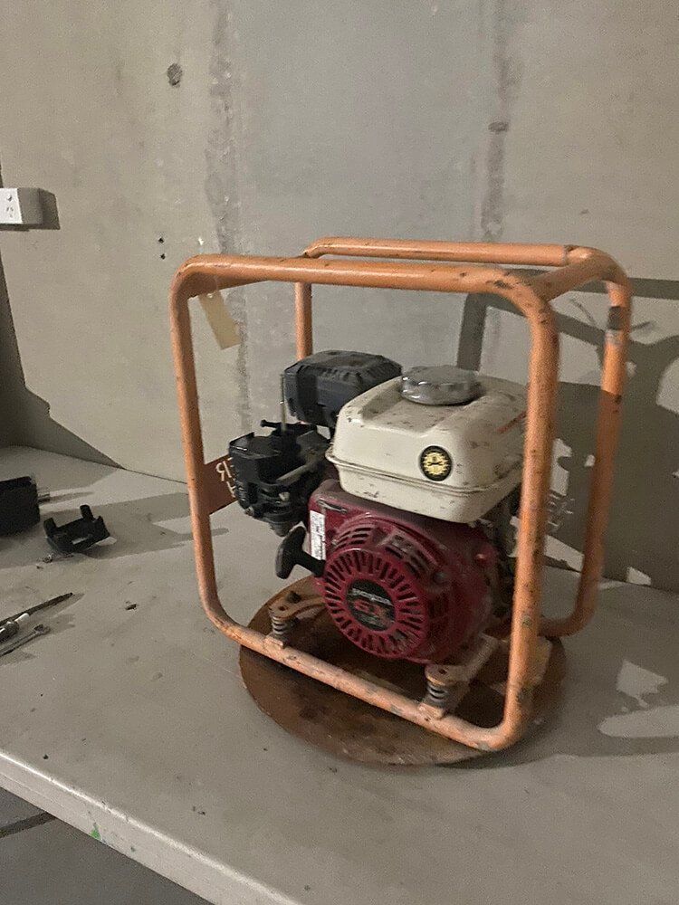 Gas-powered Plate Compactor With a Red Engine — Cairns Small Engine Repairs in Bentley Park, QLD