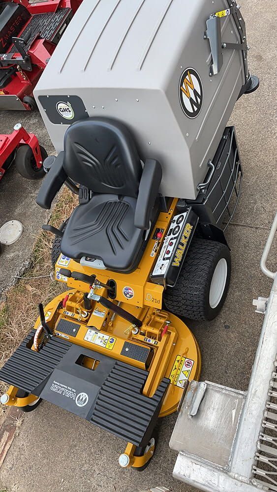 Yellow and Black Riding Lawn Mower With Grass Catcher — Cairns Small Engine Repairs in Bentley Park, QLD