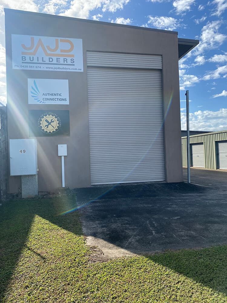 Building Exterior With Roll-up Door — Cairns Small Engine Repairs in Bentley Park, QLD