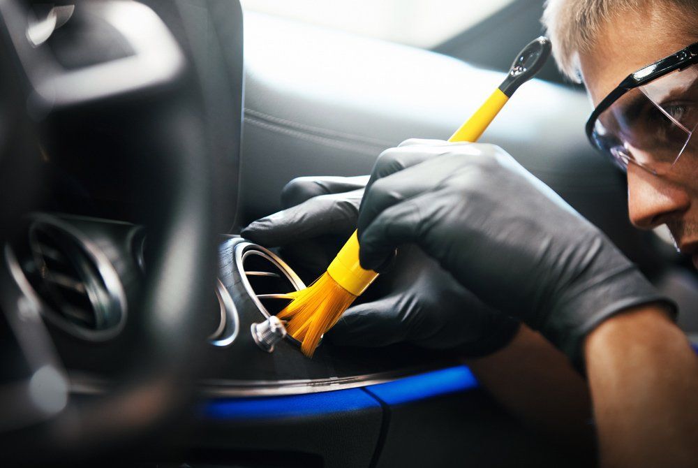 Man Using Fine Brush and Cleaning AC Vents — Wells, ME — Wells Auto Care