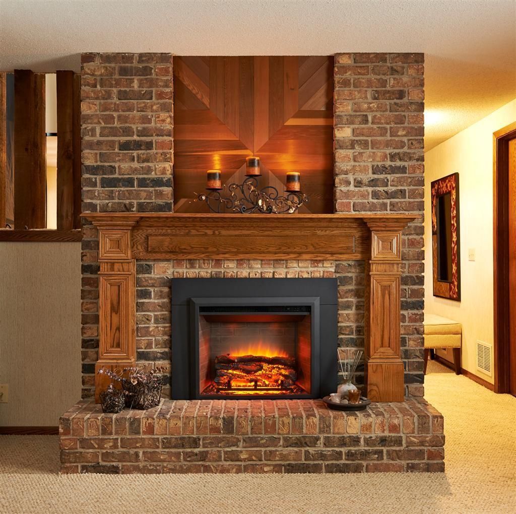 A living room with a brick fireplace and a wooden mantle
